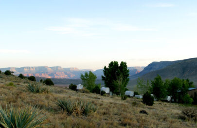 Chuckwagon tents at Bar 10 Ranch with Grand Canyon in background