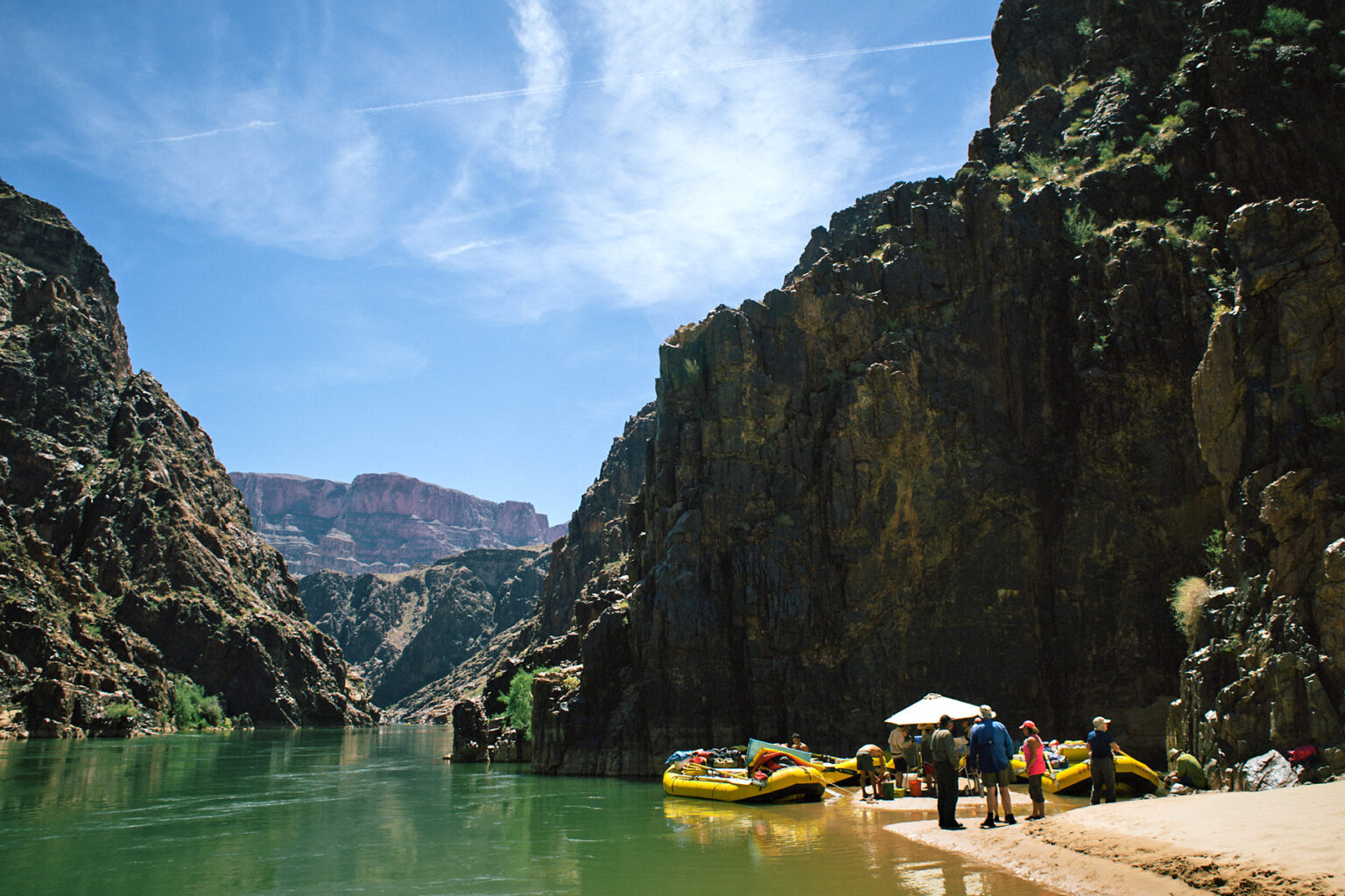 OARS rafts stop for lunch on banks of Colorado River in lower Grand Canyon