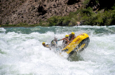 Guests hang on as OARS raft runs Lava Falls in Grand Canyon