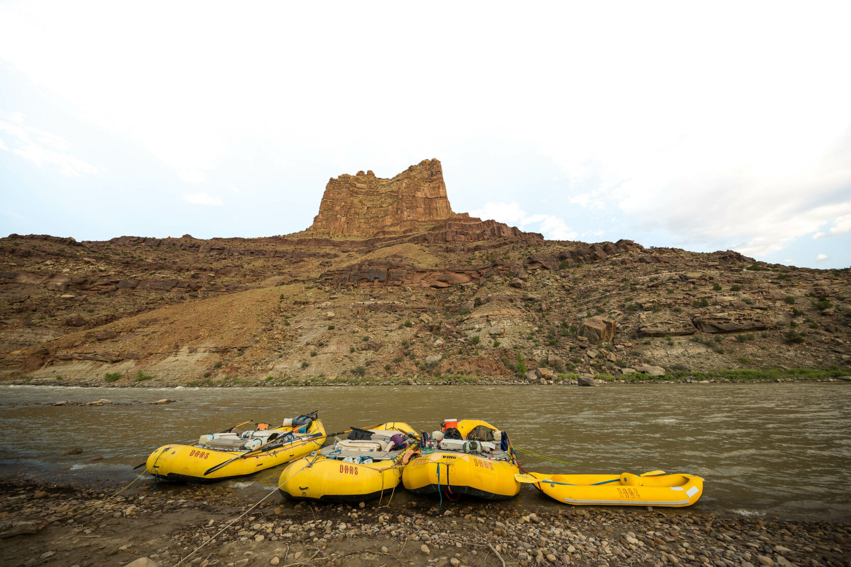 Rafts sitting on the bank of the Green River.