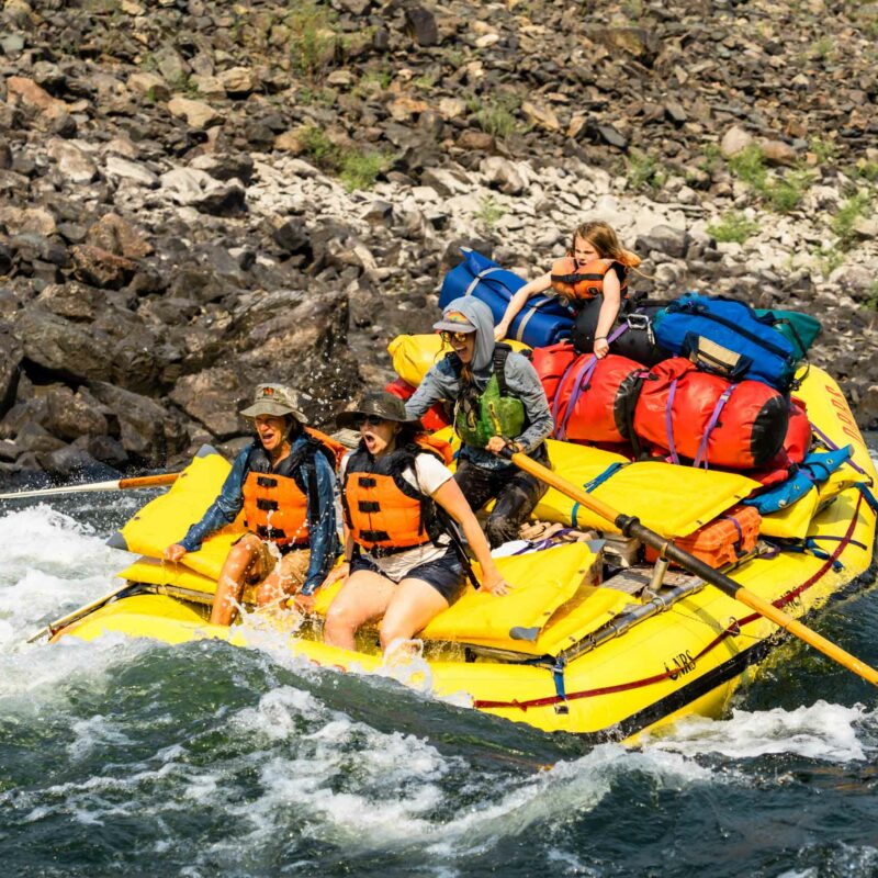 A group of people white water rafting in Idaho.