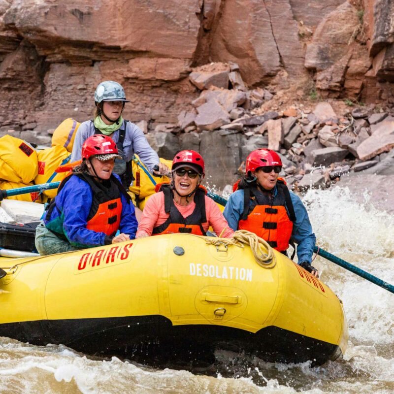 A group of women white water rafting.
