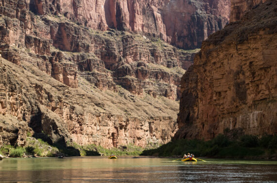 Group rafting through a canyon.