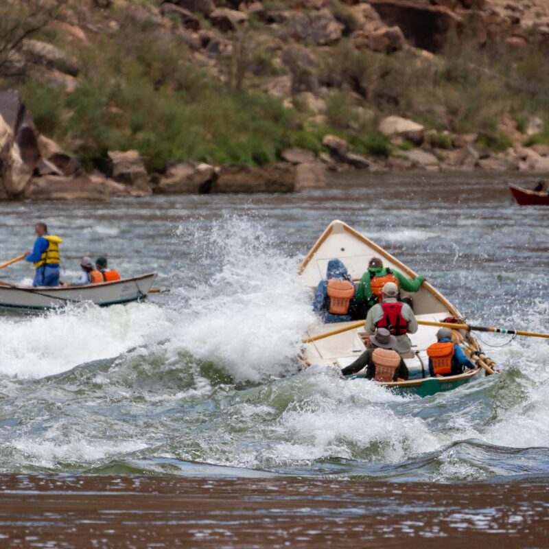 Dories make their way through a small rapid in Grand Canyon.