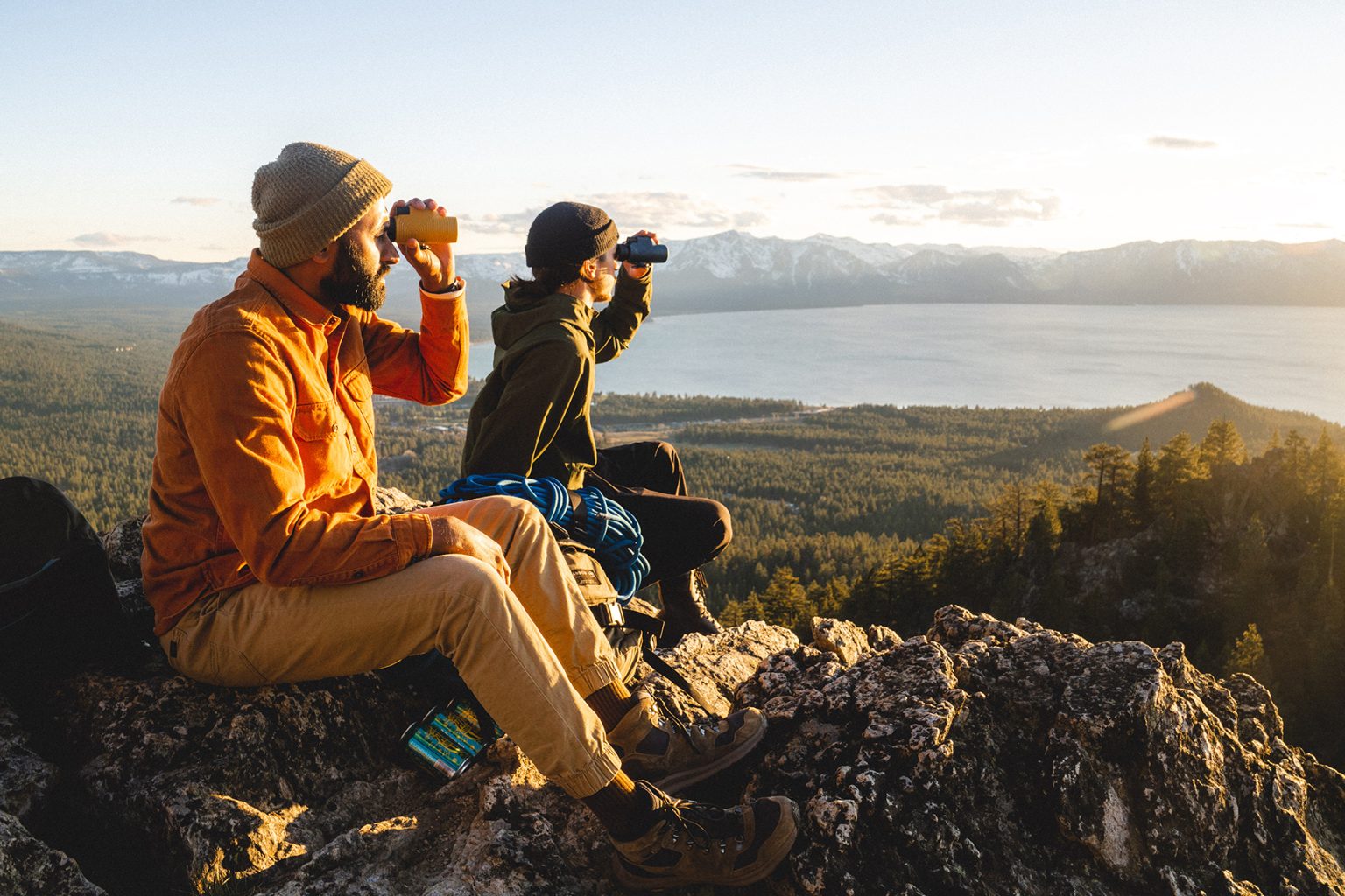 Two men at a scenic overlook using a Nocs monocle, a cool gift for outdoor lovers