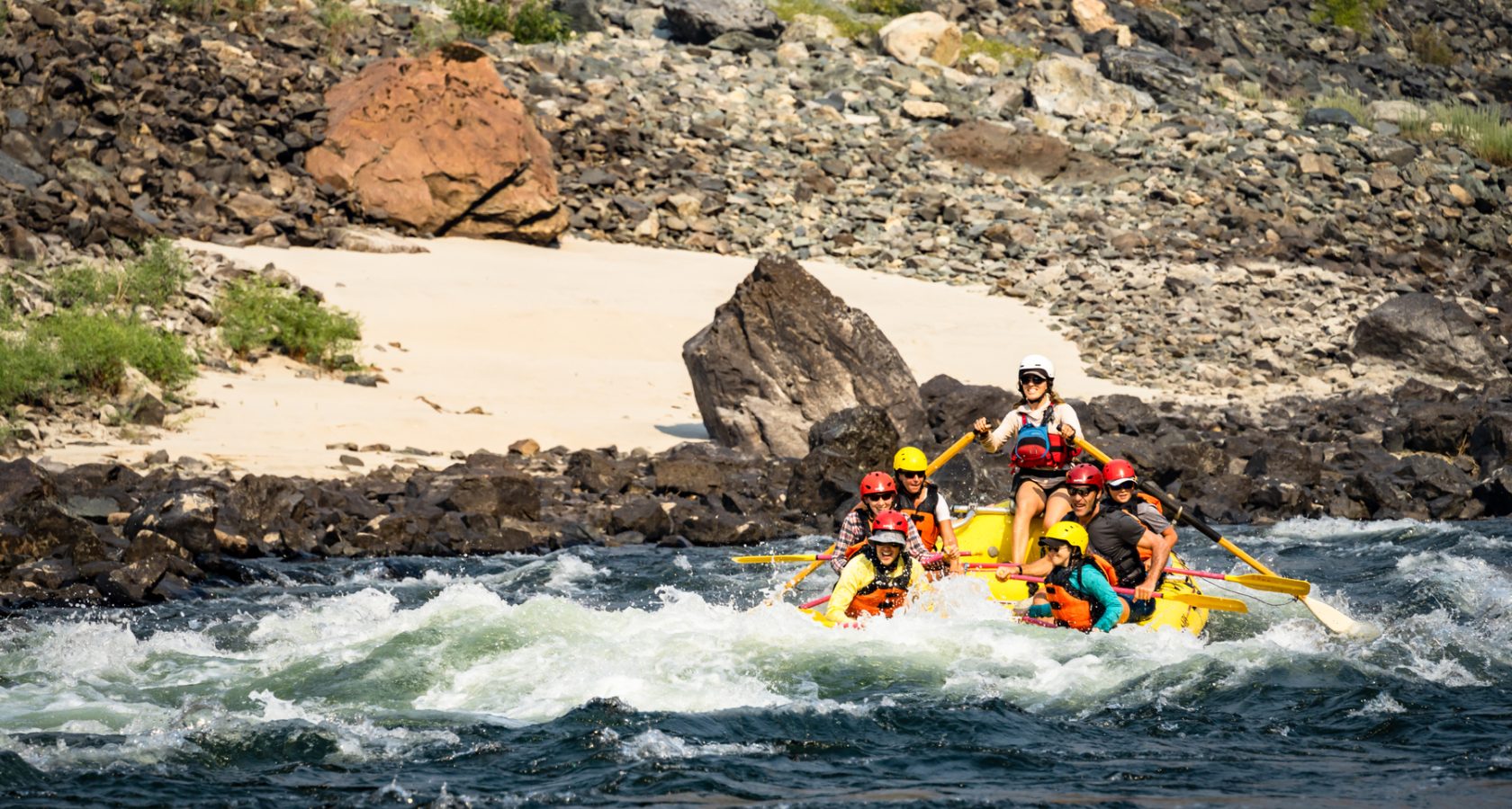 An OARS raft goes through a rapid on the Lower Salmon River