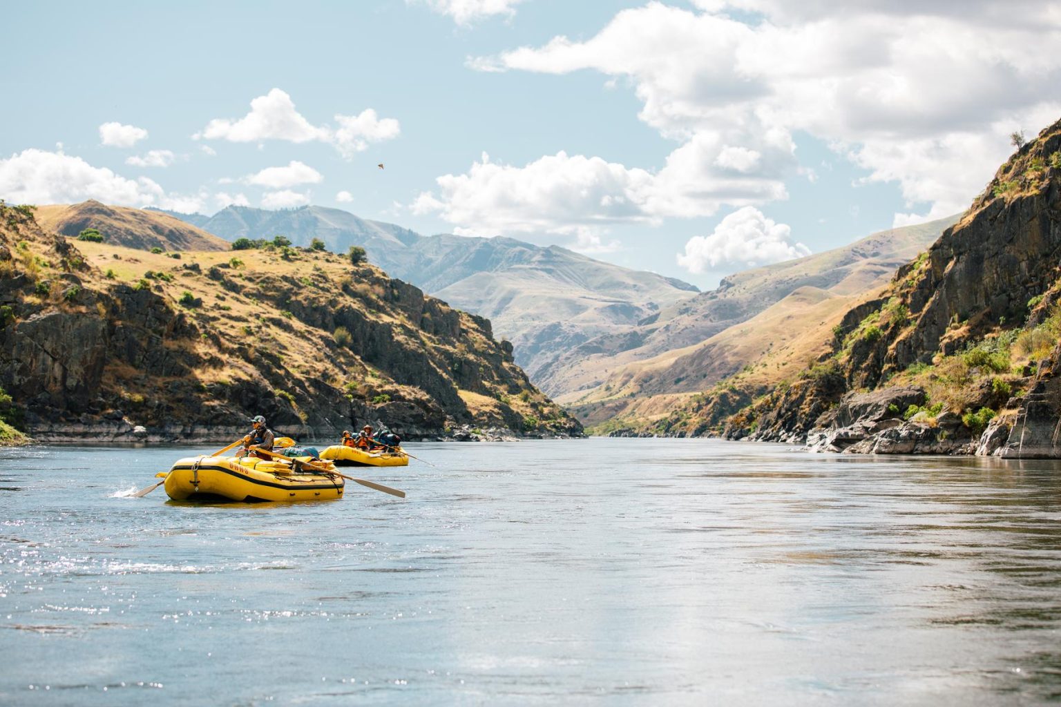 OARS rafts rowing a calm section of the Snake River